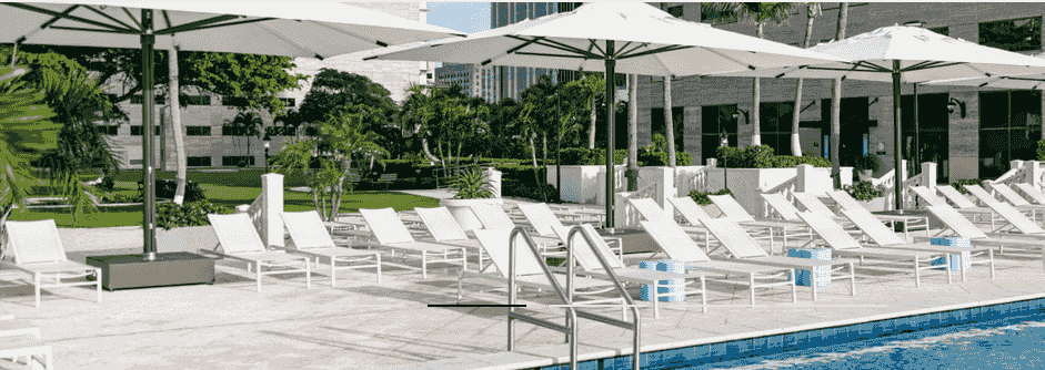 Commercial poolside patio umbrellas at a luxury hospitality resort