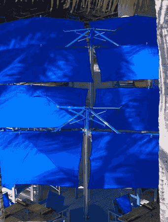 Blue multi-canopy umbrella installation