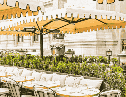 Yellow umbrellas over outdoor tables